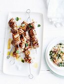 Grilled skewers of pork collar with oregano and orzo salad