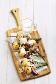 Grilled potato skewers with bacon and rosemary