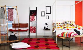 Fashionable ideas for the bedroom; colourful bed linen, scatter cushions, wardrobe and chairs