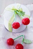 Cherry lollipops with washi tape leaves tied to small gift box