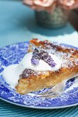 Juicy apple cake with cream and lavender flowers