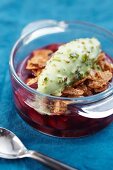Cherry soup with cereal flakes and pistachio ice cream