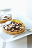 Mini chocolate tart with caramelised pears