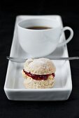 cup of coffee with small scone
