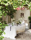 A festively laid table on a garden terrace