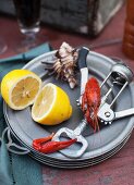 Crawfish on a Plate with a Corkscrew and Lemon
