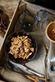 Chicken kali masala with cashew nuts in an old wooden crate