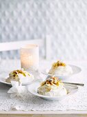 Coconut pavlovas with banana and passionfruit