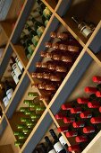 Assorted bottles of wine on wine shelves