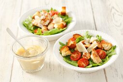 Caesar salad with tomatoes and chicken breast