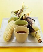 Grilled corn cobs with dips