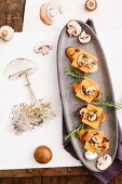 Crostini with mushrooms and cheddar