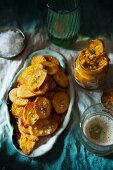 Potato crisps with a carrot and coriander dip