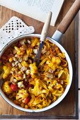 Ribbon pasta with cauliflower and tomatoes