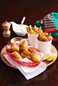 Beer-battered fish with oven-baked potato wedges