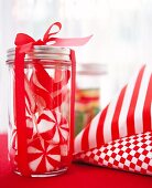 Red and white sweets in a jar