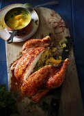 Flame-grilled chicken with orange stuffing and a mango & coconut sauce