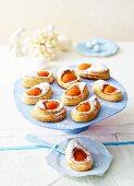 Puff pastries filled with apricot halves
