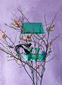 Bird house made from egg carton in Easter arrangement of twigs