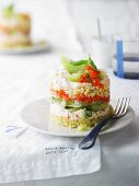 Savoury layered dish with peppers and cream cheese, melon, and nut couscous