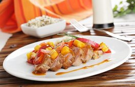 Sweet and sour pork tenderloin with peppers and rice