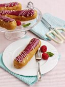 Eclairs with raspberry sauce