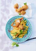Vegetable curry with cod fillet and stir-fried noodles (Asia)