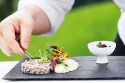 A salad of boiled beef with mayonnaise and a shallot chutney