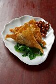 Spinach turnovers with peanuts