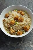 Rice noodles with vegetarian dumplings and celery