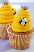 Vanilla cupcakes with lemon buttercream and bees made from fondant icing