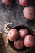 Red potatoes in a metal bowl (view from above)