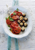 Mushrooms stuffed with sausages served with grilled tomatoes for a Mother's Day brunch