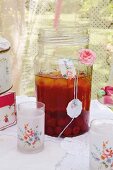 A vintage children's birthday party in a garden with berry iced tea