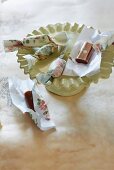 Caramel toffees wrapped in rose-printed paper