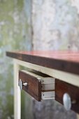 Vintage wooden table with open drawer