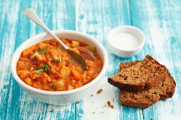 Lentil & tomato stew with pancetta and bread