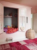 Child's cubby bed in alcove with slatted shutters