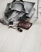 Ladies' accessories on wooden floor