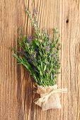 Fresh hyssop with flowers on a wooden surface