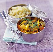 Fusilli and peppers with dill and capers in camping pots
