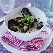 Mussel soup with chopped chives