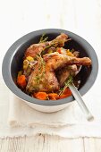 Chicken legs braised in wine, with carrots and thyme