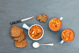 Vegetable stew with lentils and tomatoes, in cups with soda bread