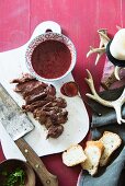 Sliced beef steak with cranberry sauce for Christmas