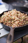 Cooked quinoa in a cast iron pan