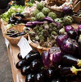Aubergines and artichokes at the market