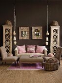Living room in natural shades with dark brown wall; pink scatter cushions and lilac rug add cheerful touches