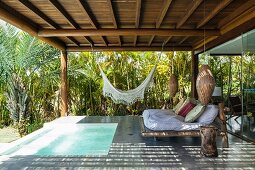 Roofed relaxation area with small pool