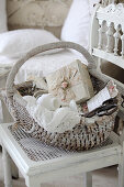 Vintage sewing utensils in wicker basket on old chair